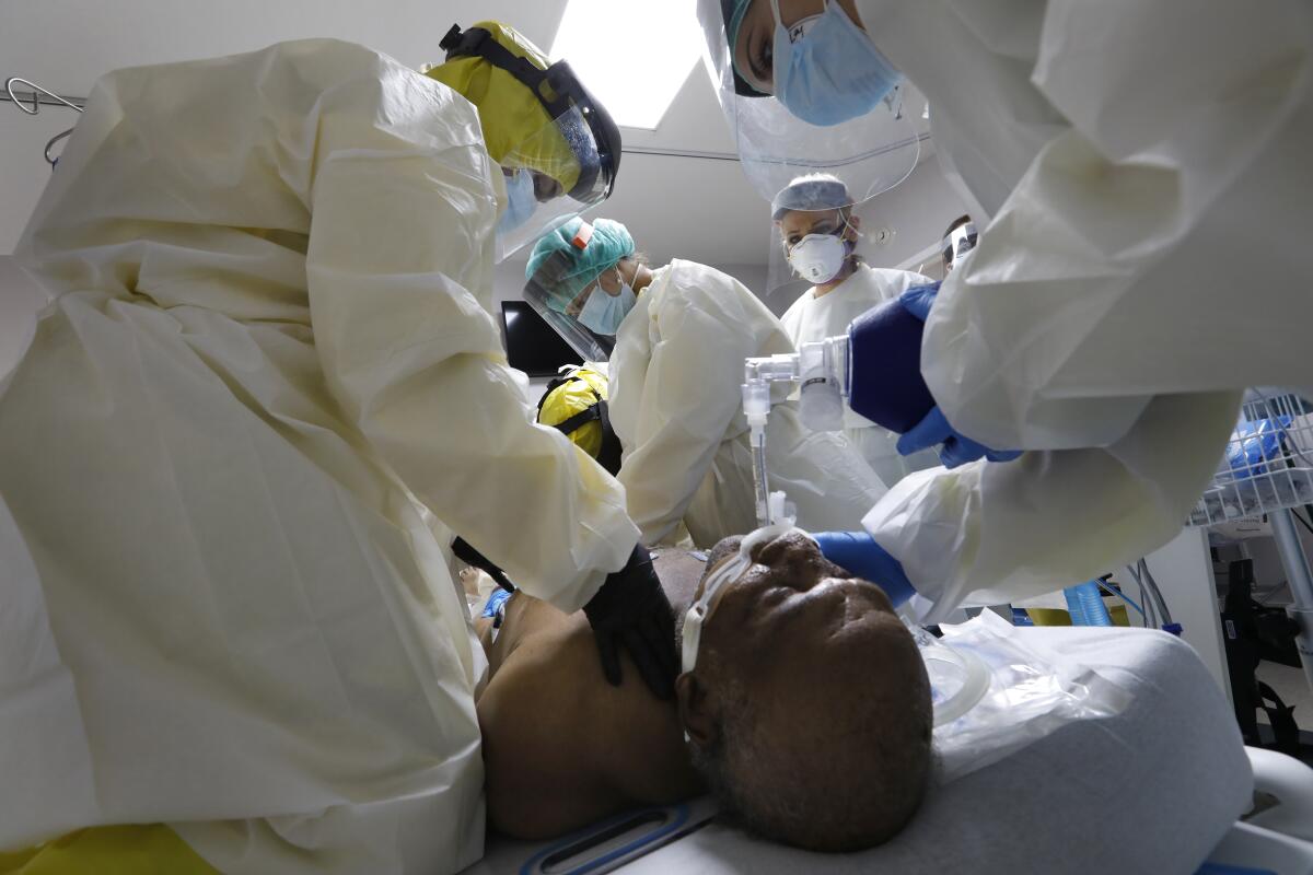 Medical students at United Memorial Medical Center in Houston work to revive a COVID-19 patient whose heart had stopped.