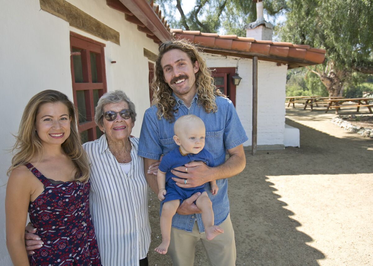 Marie Lawson with grandson Nate Larson, his wife Susan and her great-grandson Russell. (Jon Clark )