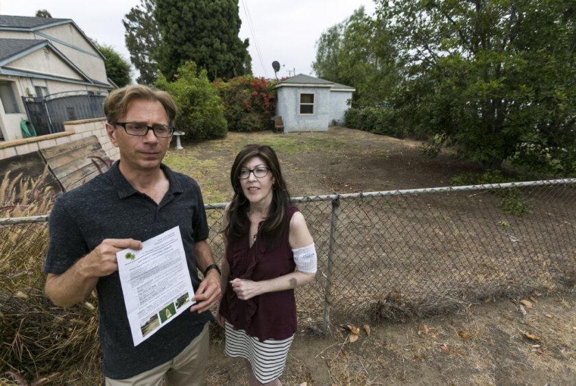 Michael Korte and his wife Laura Whitney of Glendora received a letter from the city warning that they could face fines if they don't get their brown lawn green again.