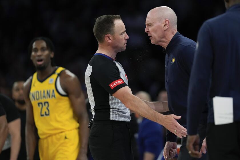 Indiana Pacers head coach Rick Carlisle, right, argues with a referee during the second half of Game 2 of the team's NBA basketball second-round playoff series against the New York Knicks, Wednesday, May 8, 2024, in New York. The Knicks won 130-121. (AP Photo/Frank Franklin II)