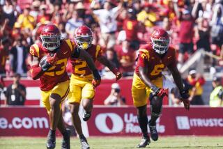 USC linebacker Desman Stephens II returns an interception 42 yards against Penn State on Saturday at the Coliseum.