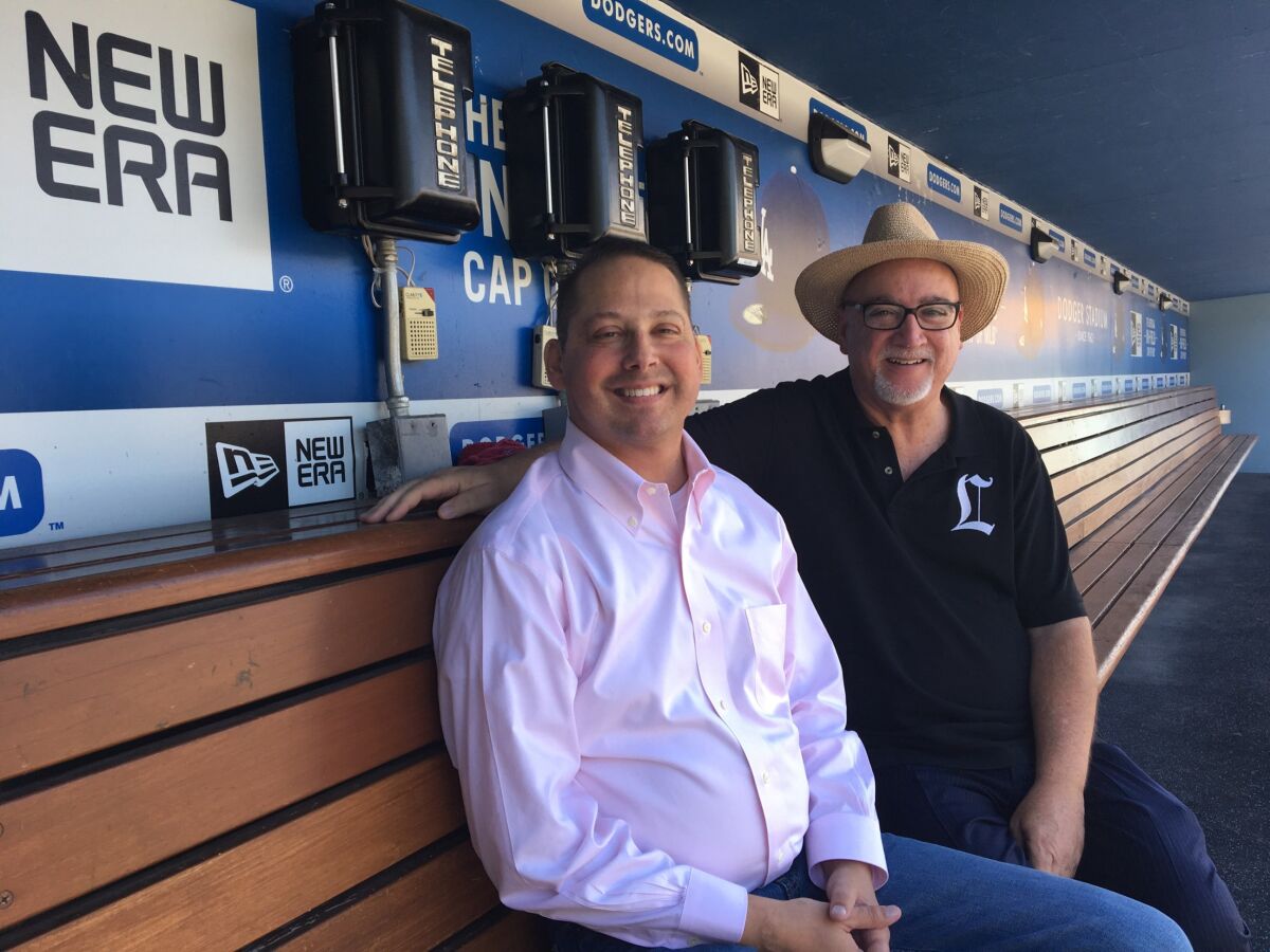 Andrew Ladores smiles with Bill Plaschke.