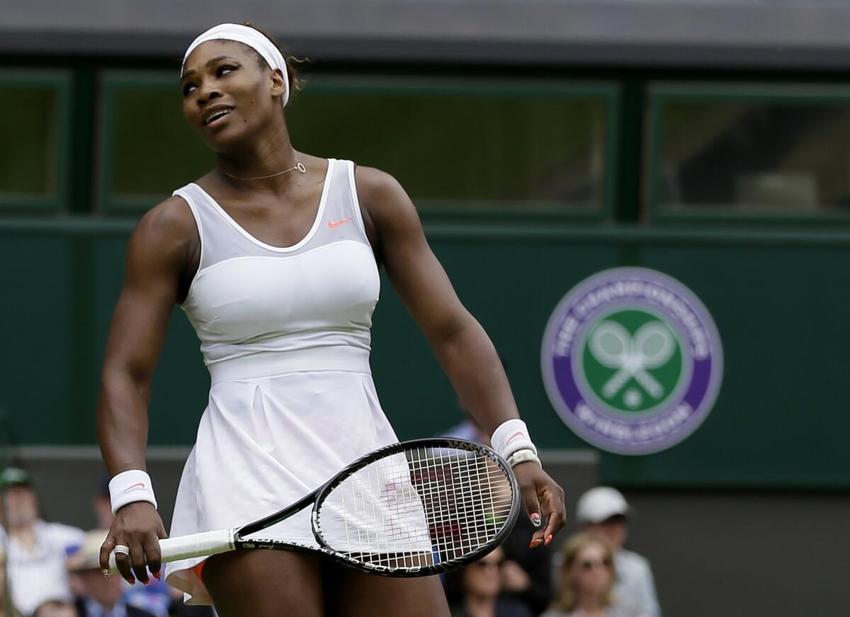 Serena Williams reacts during her loss to Sabine Lisicki at Wimbledon on Monday.