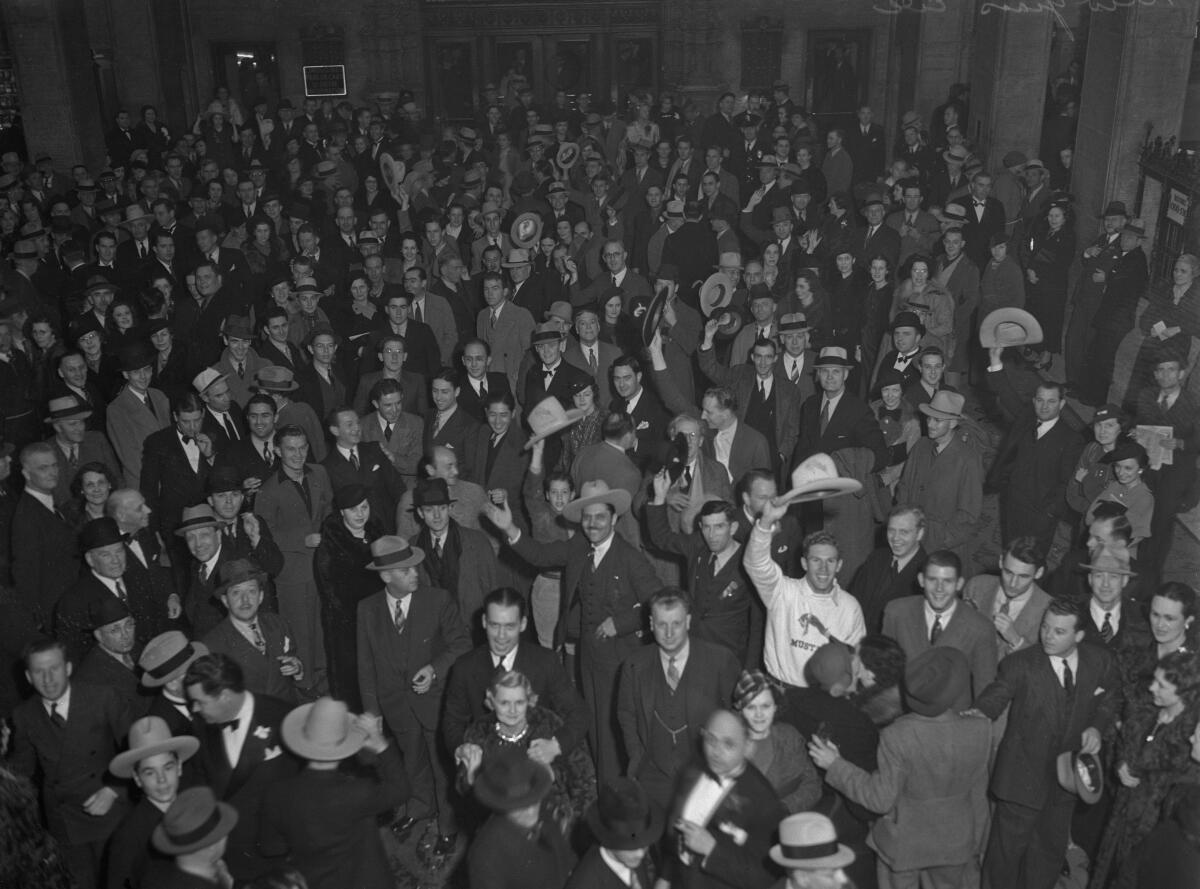 Hundreds of people crowd a patio in downtown Los Angeles.