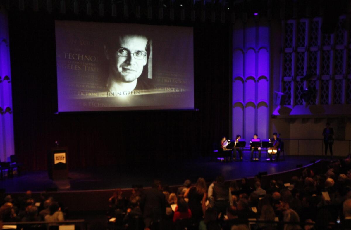 The image of author John Green is projected on the screen at the start of the 34th Annual Los Angeles Times Book Prizes event at USC.