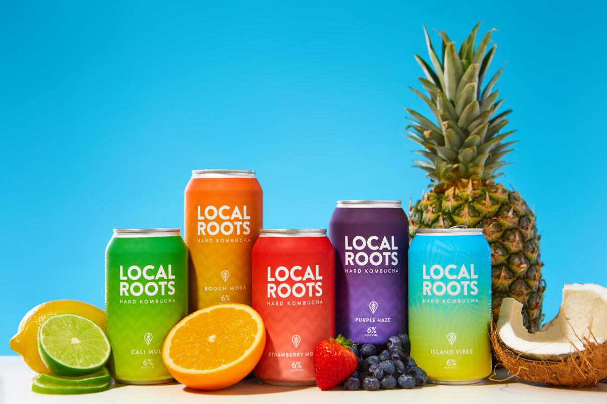 Cans of Local Roots Kombucha, available in a variety of flavors