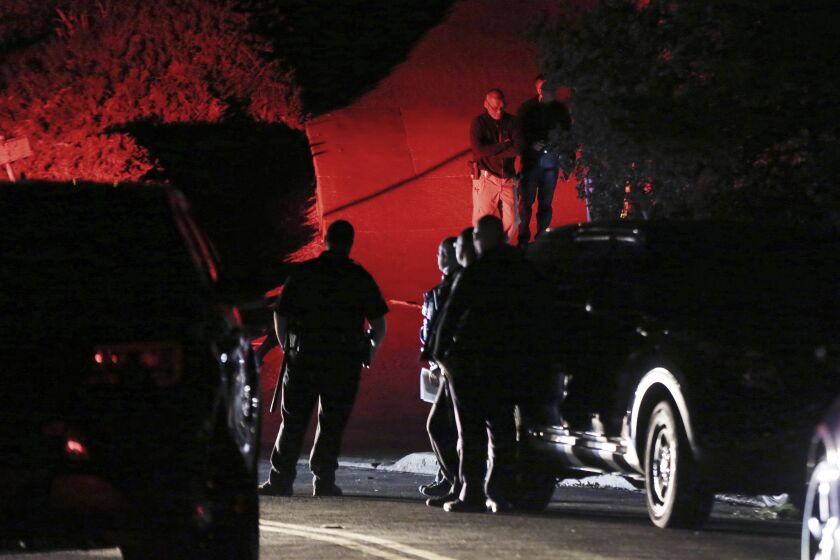 Contra Costa County Sheriff deputies investigate a multiple shooting in Orinda, Calif., on Thursday, Oct. 31, 2019. Four people were killed and four others wounded in a Halloween night party shooting at a large rental home in a wealthy San Francisco Bay Area community, police said Friday. The shooting in the city of about 20,000 just east of Berkeley, happened at a party attended by 100 people said police chief David Cook. (Ray Chavez/East Bay Times via AP)