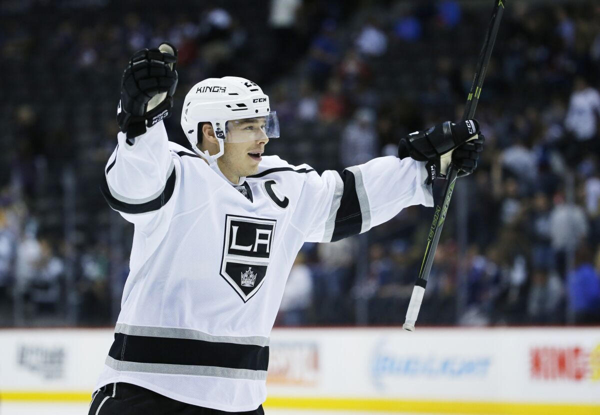 Kings right wing Dustin Brown celebrates after scoring the game-winning shoot out goal against the Avalanche during a preseason game.