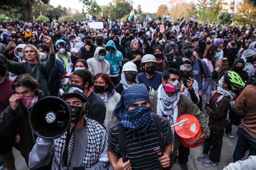 Irvine, CA, Wednesday, May 15, 2024 - Scores of law enforcement personnel from various agencies gather at UC Irvine to displace hundreds of demonstrating students, faculty and supporters protesting the treatment of Palestinians and the UC system's investments in Isreali interests. (Robert Gauthier/Los Angeles Times)