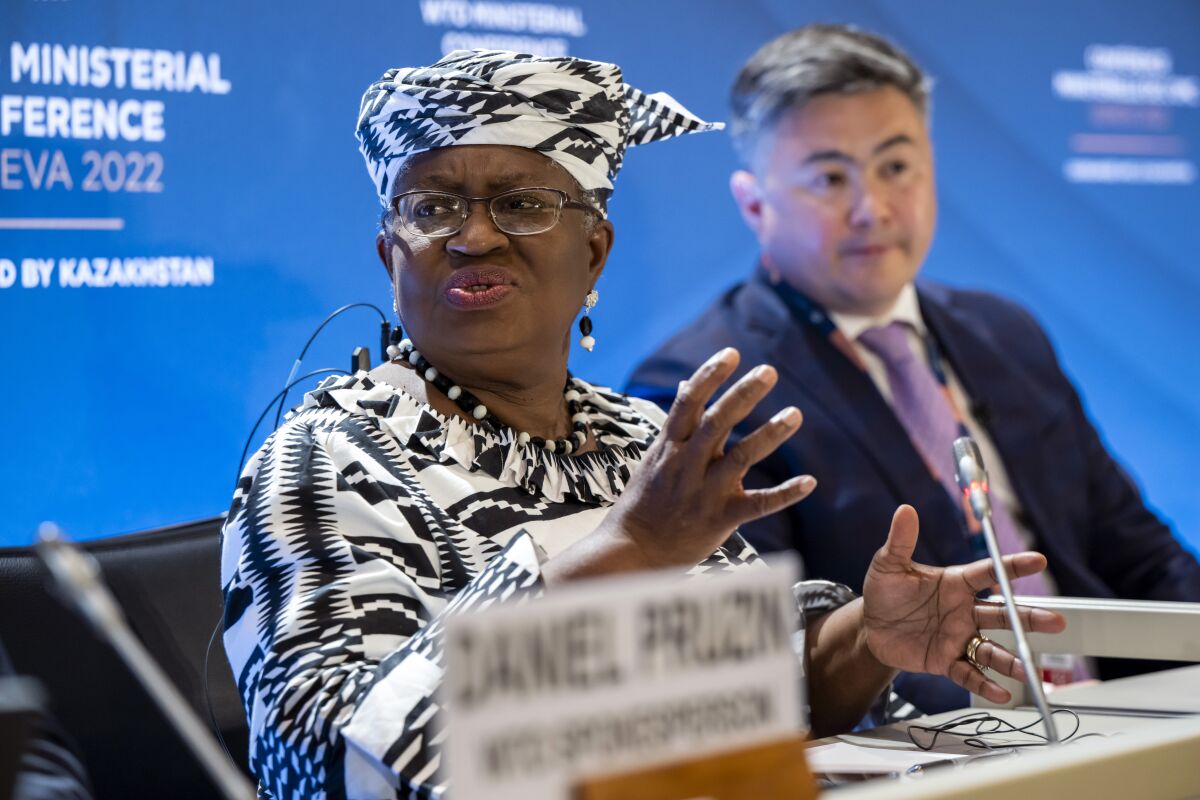 Director-General of the World Trade Organisation (WTO) Ngozi Okonjo-Iweala, left, and Timur Suleimenov, Chair of the 12th Ministerial Conference attend a press conference before the opening of the 12th Ministerial Conference at the headquarters of the World Trade Organization (WTO), in Geneva, Switzerland, Sunday, June 12, 2022. For the first time in 4 1/2 years, after a pandemic pause, government ministers from WTO countries will gather for four days starting Sunday to tackle issues like overfishing of the seas, COVID-19 vaccines for the developing world and food security. (Martial Trezzini/Keystone via AP)