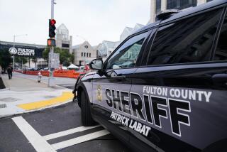 Barricades are seen near the Fulton County courthouse, Monday, Aug. 7, 2023, in Atlanta. The sheriff's office are implementing various security measures ahead of District Attorney Fani Willis possibly seeking an indictment in her investigation into whether former President Donald Trump and his allies illegally meddled in the 2020 election in Georgia. (AP Photo/Brynn Anderson)