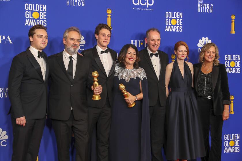 BEVERLY HILLS, CA-JANUARY 05: Dean-Charles Chapman, Sam Mendes, George MacKay, Pippa Harris, Callum McDougall, Rose Leslie, and Jayne-Ann Tenggren from “1917,” in the photo deadline room at the 77th Golden Globe Awards at the Beverly Hilton on January 05, 2020 (Allen J. Schaben / Los Angeles Times)