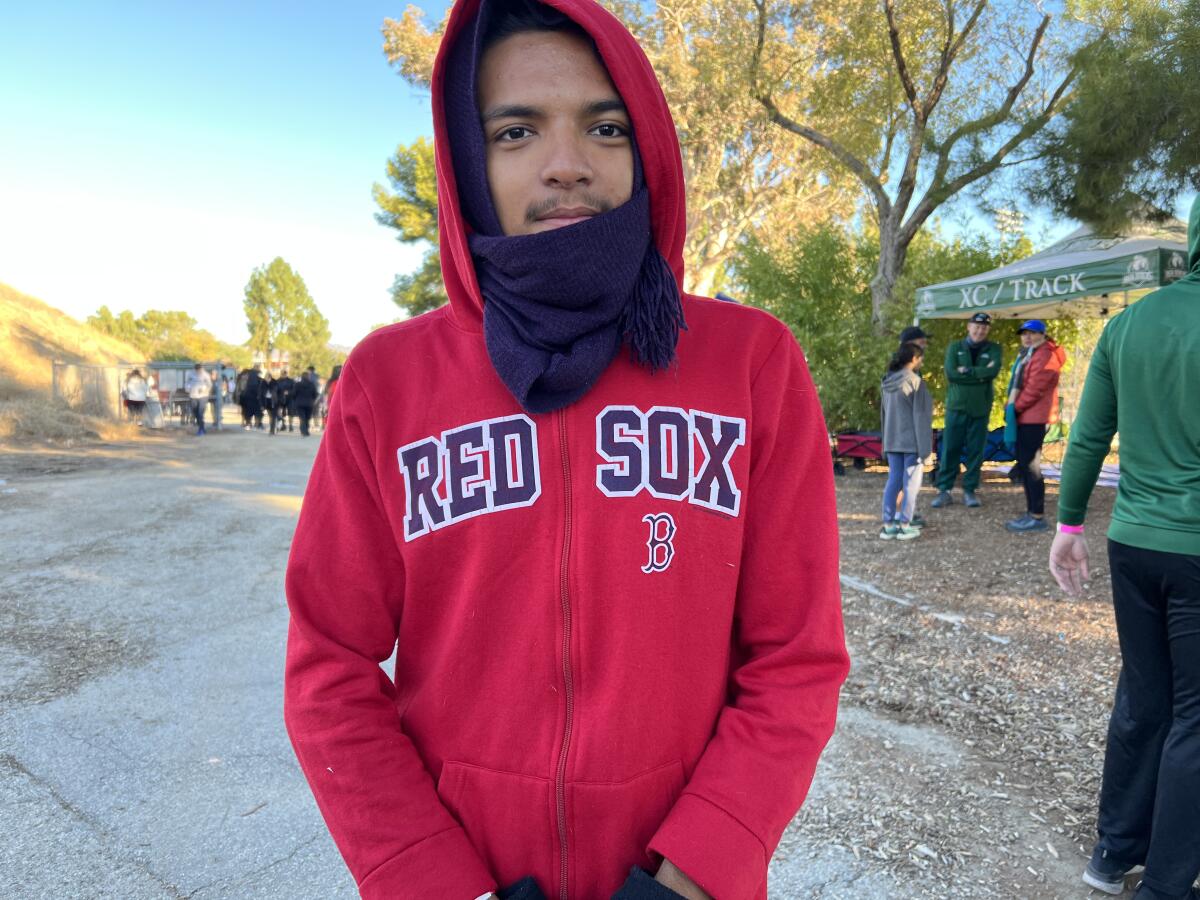 Monroe High cross-country runner Joseluis Rincon poses for a photo.