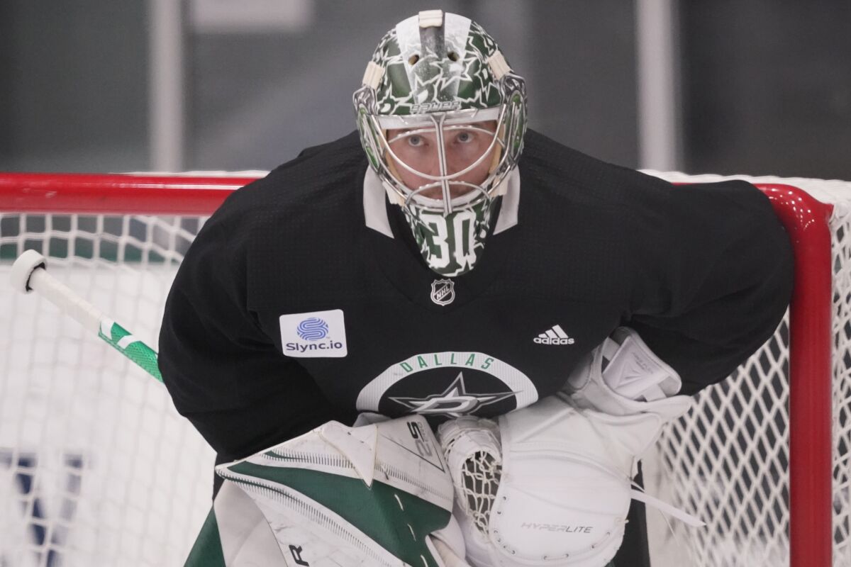 FILE - Dallas Stars goaltender Ben Bishop defends the goal during an NHL hockey practice in Frisco, Texas, Sept. 23, 2021. Bishop has just been traded by Dallas to the Buffalo Sabres along with a 7th-round draft pick for future considerations. (AP Photo/LM Otero, File)