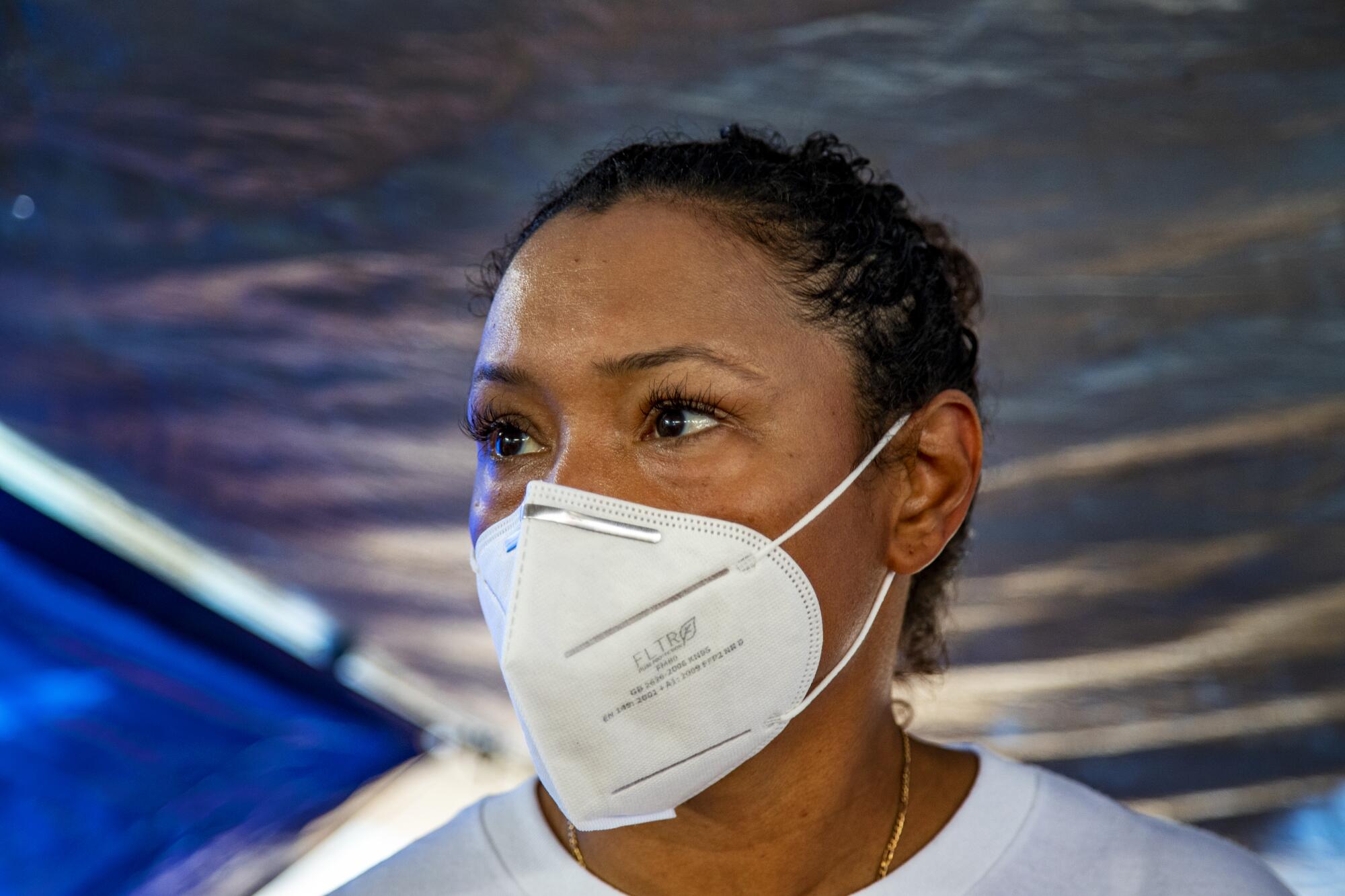 Activist Felicia Rangel-Samponaro wearing a face mask