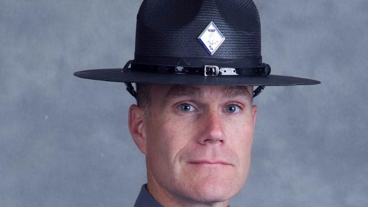 Lt. H. Jay Cullen poses for his official photo. Cullen and Trooper-Pilot Berke M.M. Bates were killed when their helicopter crashed while assisting during the protests in Charlottesville, Va., (Handout / Getty Images)