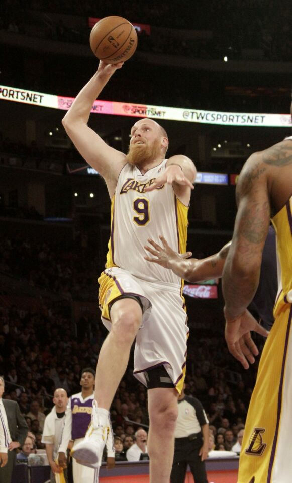 Lakers center Chris Kaman shoots during the team's 115-99 win Sunday over the Phoenix Suns at Staples Center.
