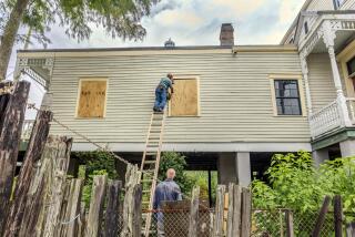 The windows of a raised historic house are boarded up as residents prepare for the arrival of Hurricane Francine along the Louisiana coast on Monday, Sept. 9, 2024, in Lafitte, La. (Chris Granger/The Times-Picayune/The New Orleans Advocate via AP)