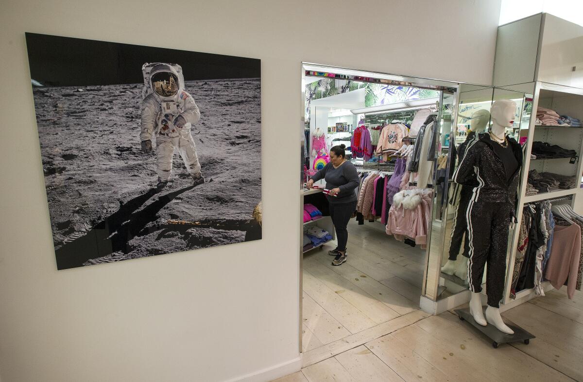 A photograph of astronaut Buzz Aldrin walking on the moon in Ron Robinson’s store on Melrose Avenue.