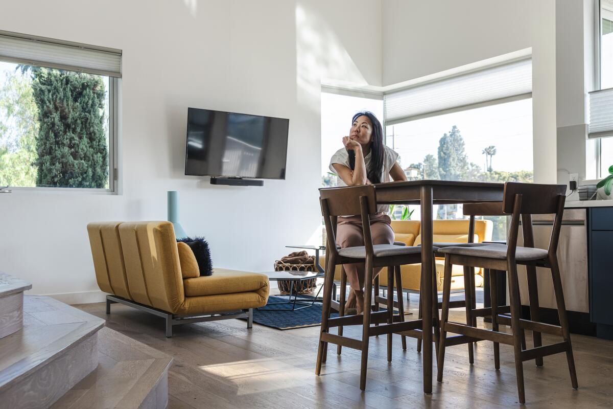 Vivian Mo sits in the kitchen of her ADU