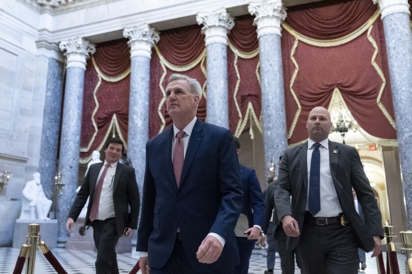 House Speaker Kevin McCarthy of Calif., center, walks from the House floor on Capitol Hill, Tuesday, Jan. 10, 2023, in Washington. (AP Photo/Alex Brandon)