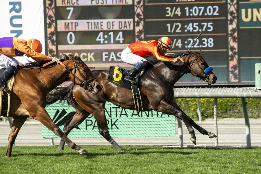 In this image provided by Benoit Photo, Fast and Shiny, right, with Abel Cedillo aboard, wins the $100,000 Angels Flight Stakes horse race Sunday, March 26, 2023, at Santa Anita Park in Arcadia, Calif. (Benoit Photo via AP)