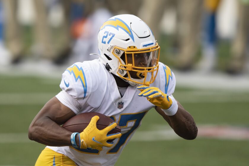 Los Angeles Chargers running back Joshua Kelley (27) runs the ball in the second half during an NFL football game against the Cincinnati Bengals, Sunday, Sept. 13, 2020, in Cincinnati. (AP Photo/Emilee Chinn)