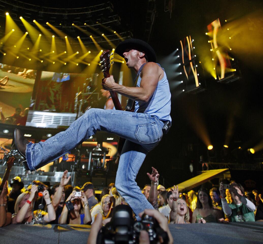 Country music singer Kenny Chesney performs his Poets and Pirates Tour at the Staples Center in Los Angeles.