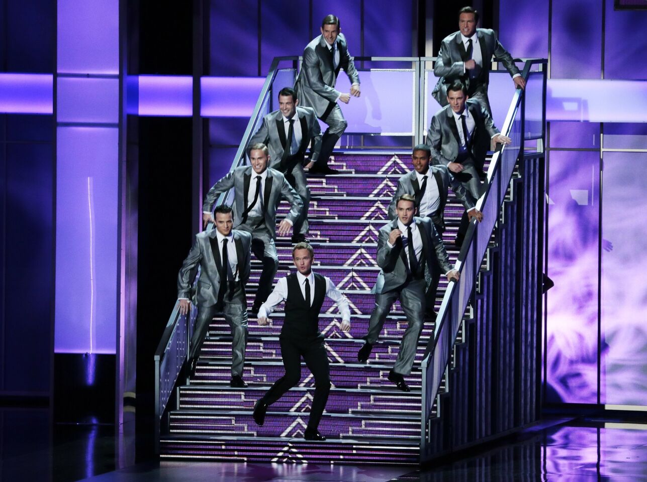 Here's where we say something about how host Neil Patrick Harris seemed obligated to do a song-and-dance number for the Emmys and, therefore, did a song called "This Is the Number in the Middle of the Show," which seemed uninspired and dull. And then we wrote something about how it didn't seem like anyone really cared enough to put their hearts into it. And neither did we.