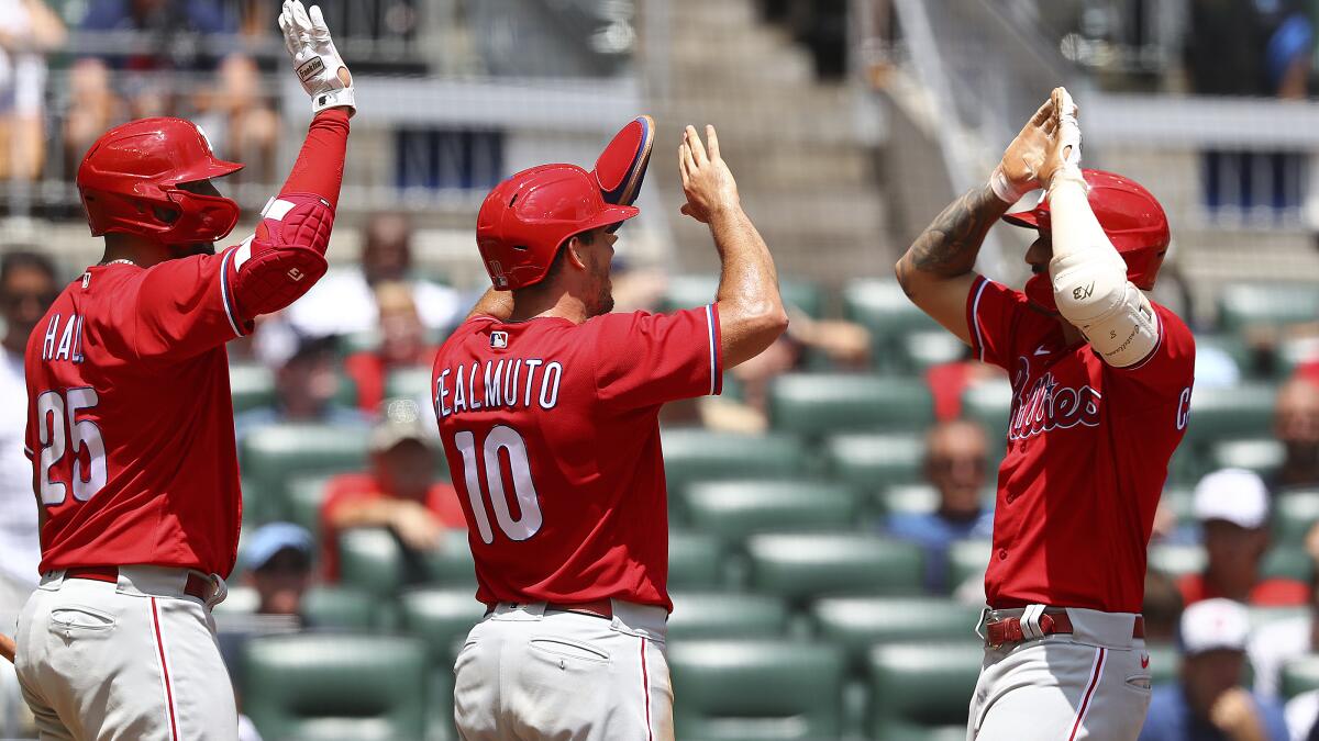 Castellanos hits 2 homers, makes pivotal throw for an out, as Phillies beat  Braves 6-5 in 10 - The San Diego Union-Tribune