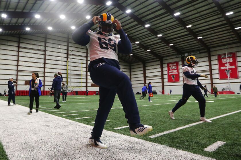 Rams defensive tackle Sebastian Joseph-Day stretches during a Super Bowl LIII practice session on Jan. 30, 2019.