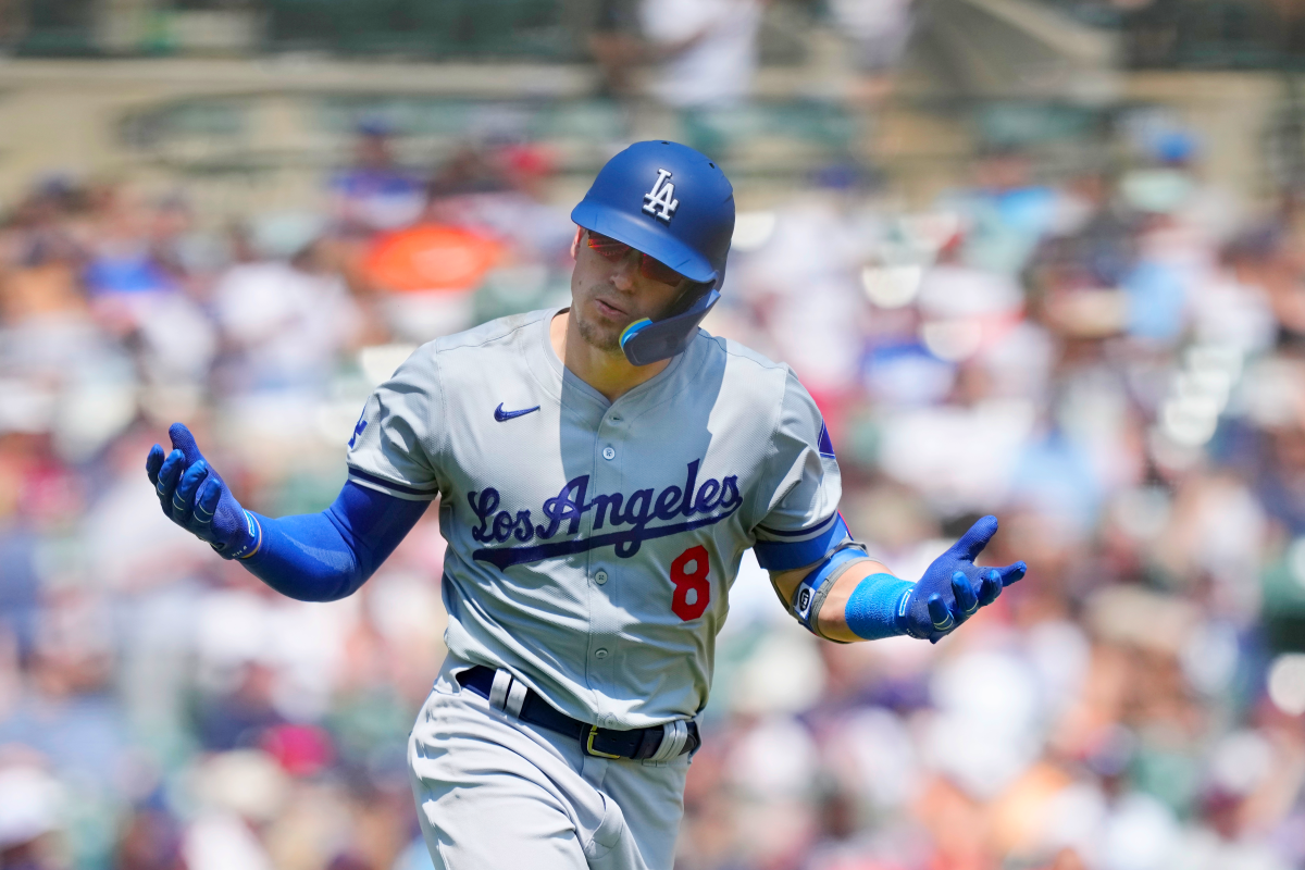 Dodgers shortstop Kiké Hernández holds his arms out as he looks toward the dugout after hitting a two-run home run Saturday.