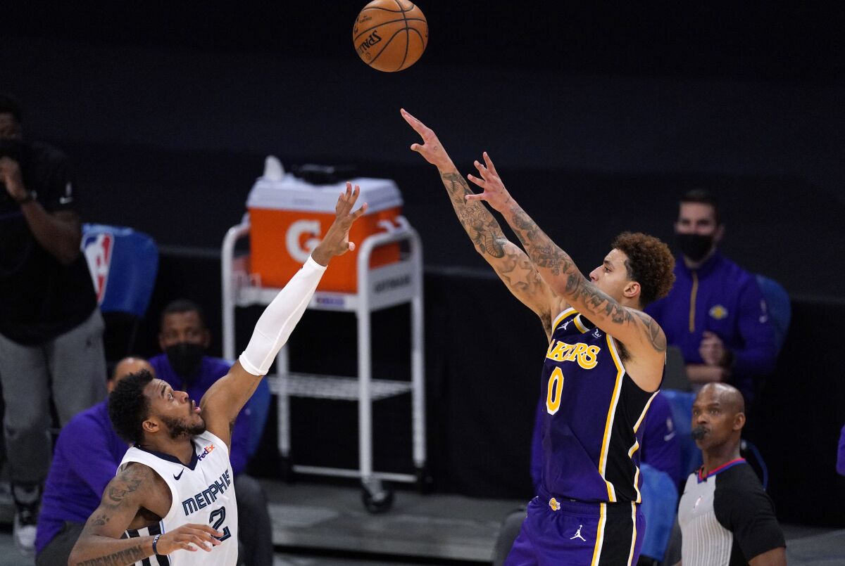 Lakers forward Kyle Kuzma shoots over Memphis Grizzlies center Xavier Tillman.