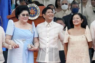 President Ferdinand Marcos Jr. stands with his mother Imelda Marcos, left, and his wife Maria Louise Marcos, right, during the inauguration ceremony at National Museum on Thursday, June 30, 2022 in Manila, Philippines. Marcos was sworn in as the country's 17th president. (AP Photo/Aaron Favila)