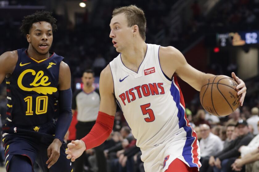 Detroit Pistons' Luke Kennard (5) drives against Cleveland Cavaliers' Darius Garland (10) in the second half of an NBA basketball game, Tuesday, Dec. 3, 2019, in Cleveland. (AP Photo/Tony Dejak)