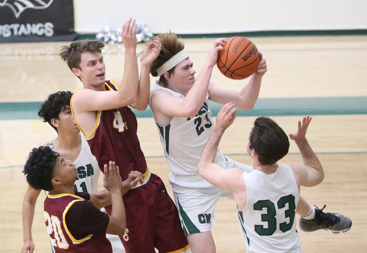 Costa Mesa's Blake Wolf (23), shown competing against Estancia in January 2020, had 22 points in the Mustangs' 93-60 win.