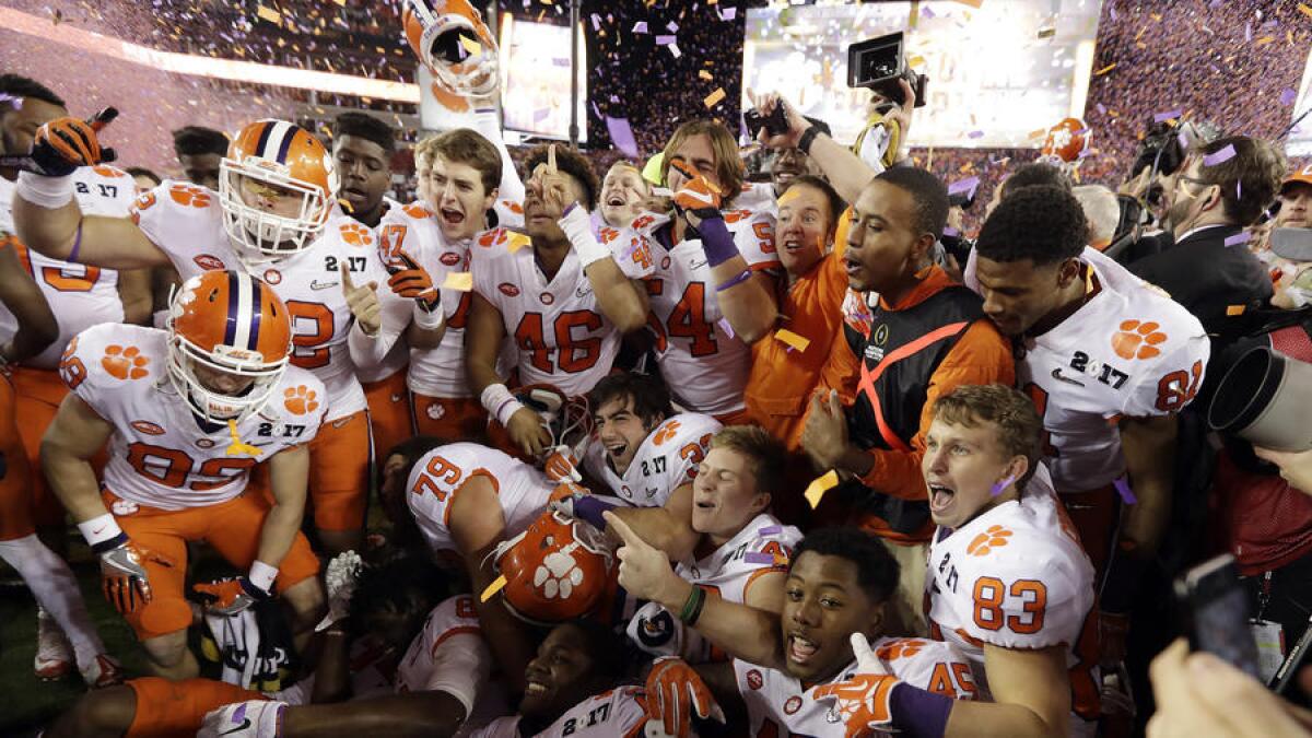 Clemson players celebrate after defeating Alabama, 35-31, in the College Football Playoff national championship game.
