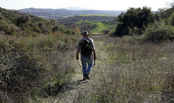 Coyote trapper on trail at Cal Poly Pomona