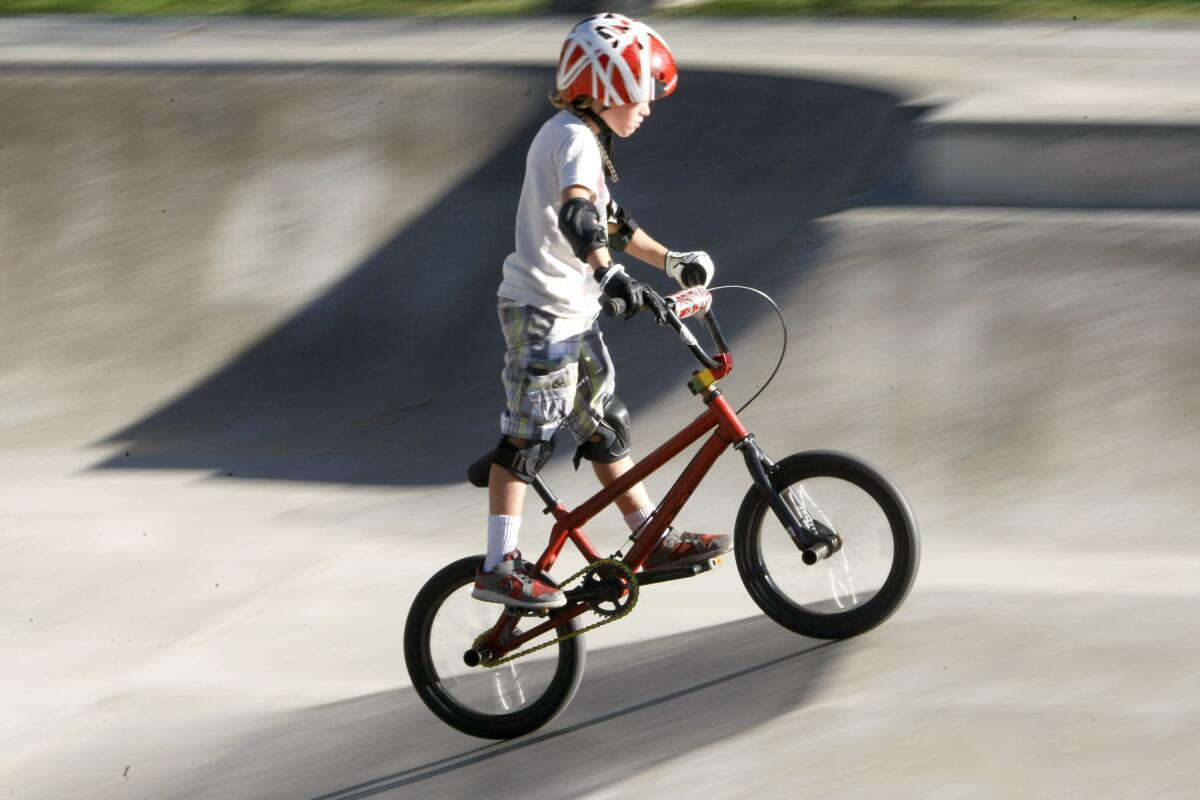 Ty Bodley,6, rides the bowl during the city of Burbank's end of summer BMX Bike-tacular.