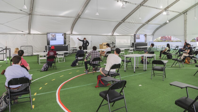 UCSD Professor David Victor teaches his Policy Making Process class in a tent at UCSD on Friday.