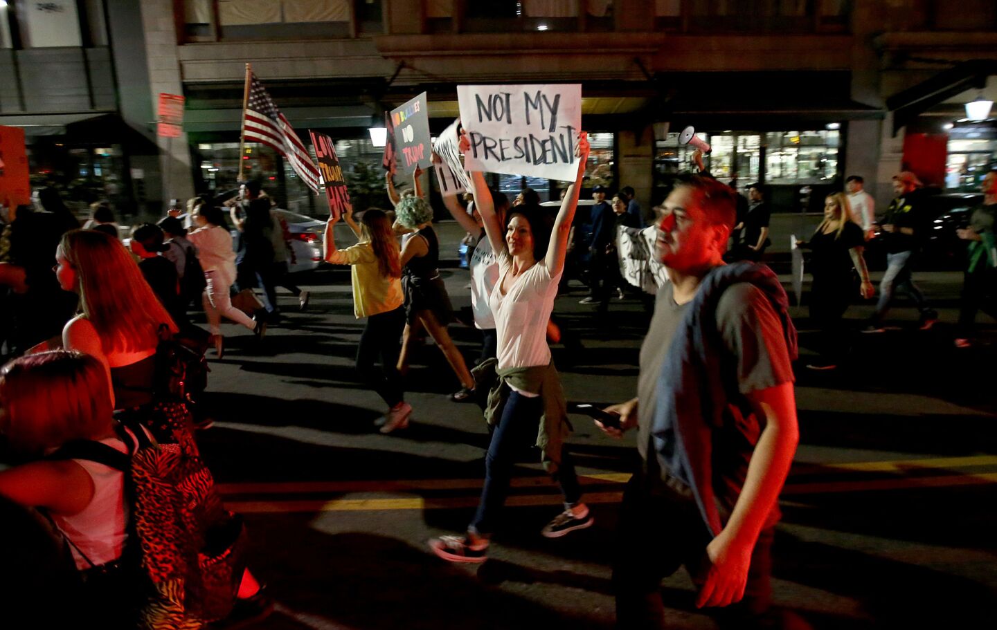 Hundreds of anti-Trump protesters stream down Hill Street in downtown Los Angeles on Friday night.