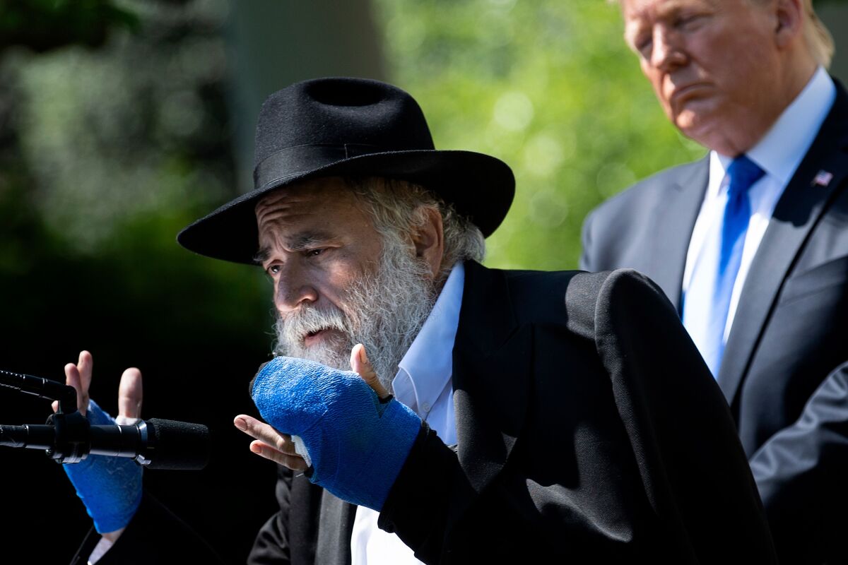 Rabbi Yisroel Goldstein, with President Trump, speaks during the National Day of Prayer Service at the White House in 2019