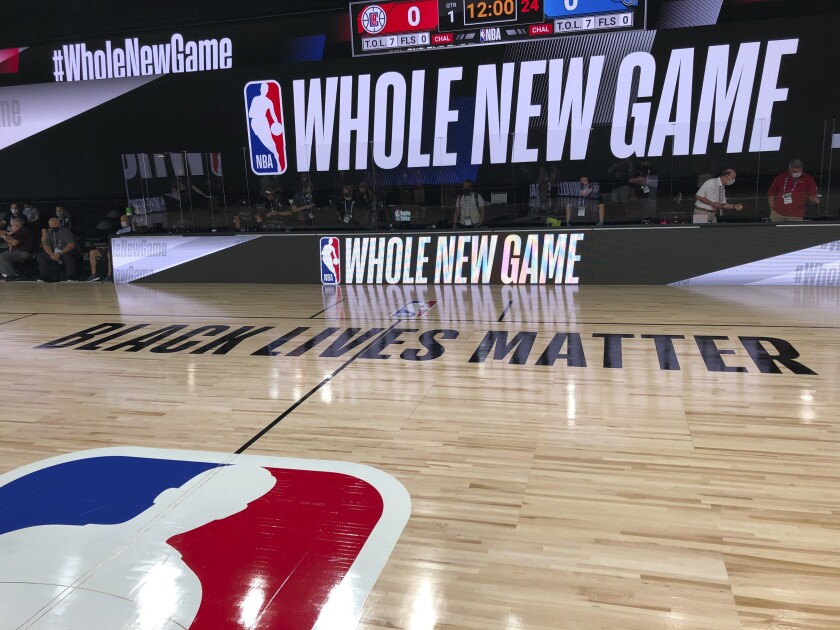 A basketball court painted with the slogan "Black Lives Matter" at the ESPN Wide World of Sports complex in Orlando, Fla.