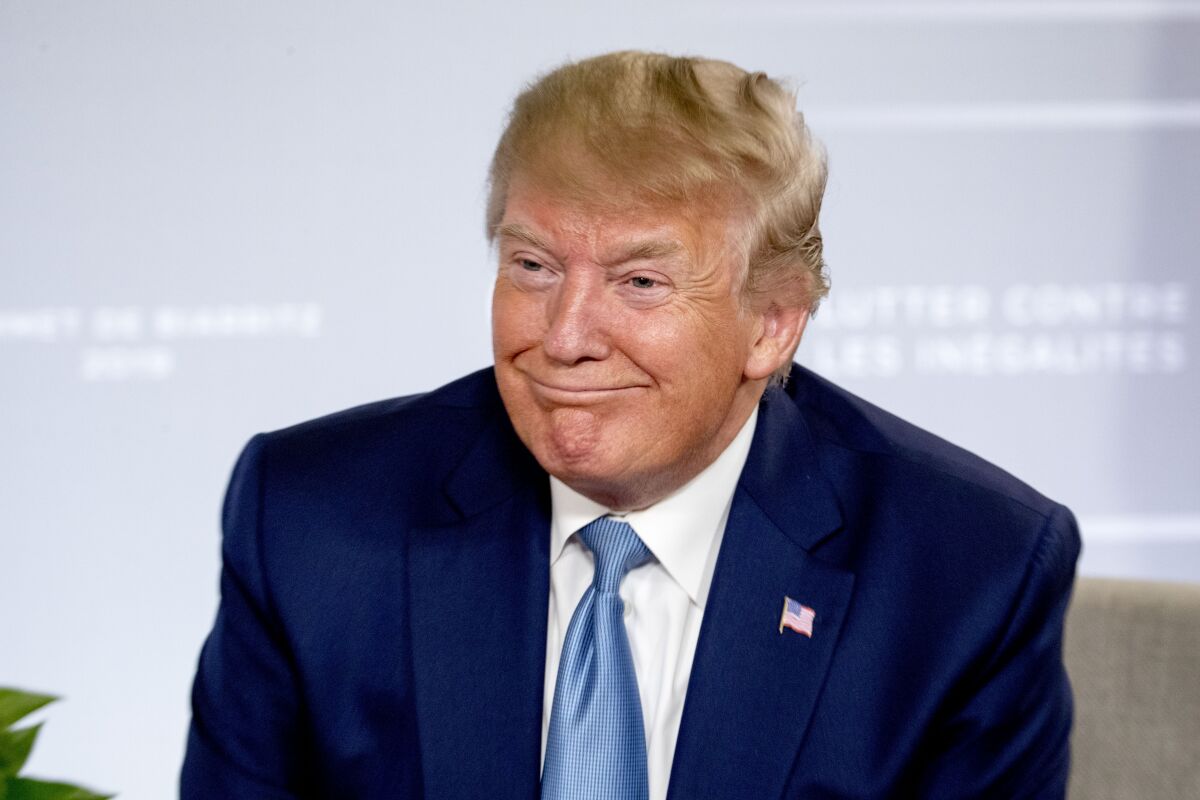 Donald Trump smiles during a news conference with Japanese Prime Minister Shinzo Abe at the G-7 summit in Biarritz, France, Sunday, Aug. 25, 2019, where they announced that the U.S. and Japan have agreed in principle on a new trade agreement.