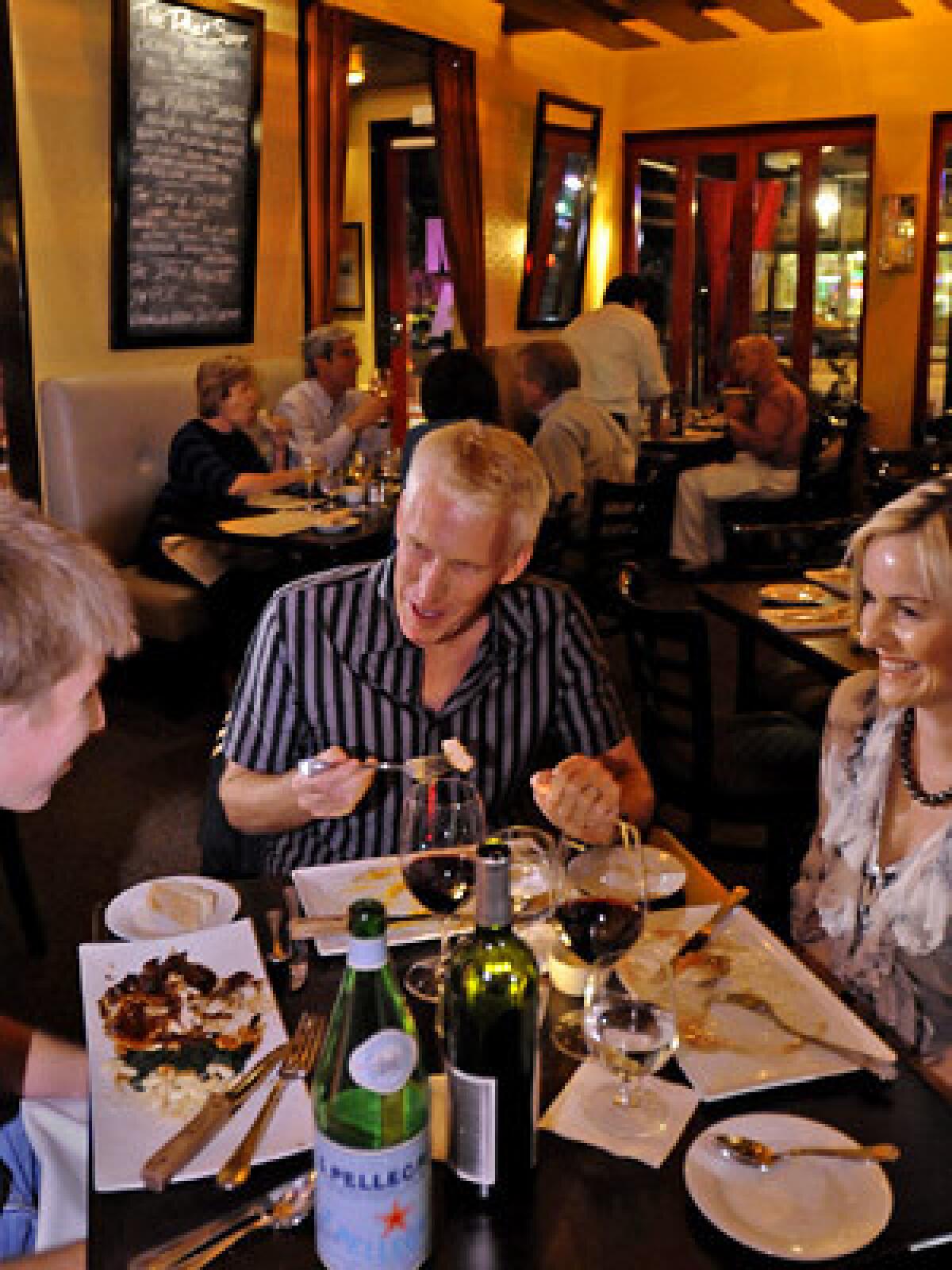 CASUAL MAKEOVER: Diners at Max savor the simple yet of-the-moment menu in a warm bistro atmosphere.