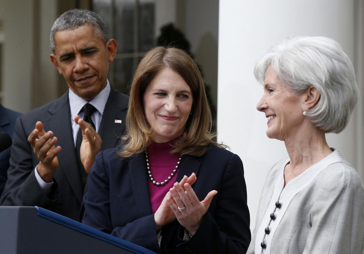 Soon to be her problem: HHS Secretary-designate Sylvia Mathews Burwell, center, flanked by President Obama and outgoing HHs Secretary Kathleen Sebelius.