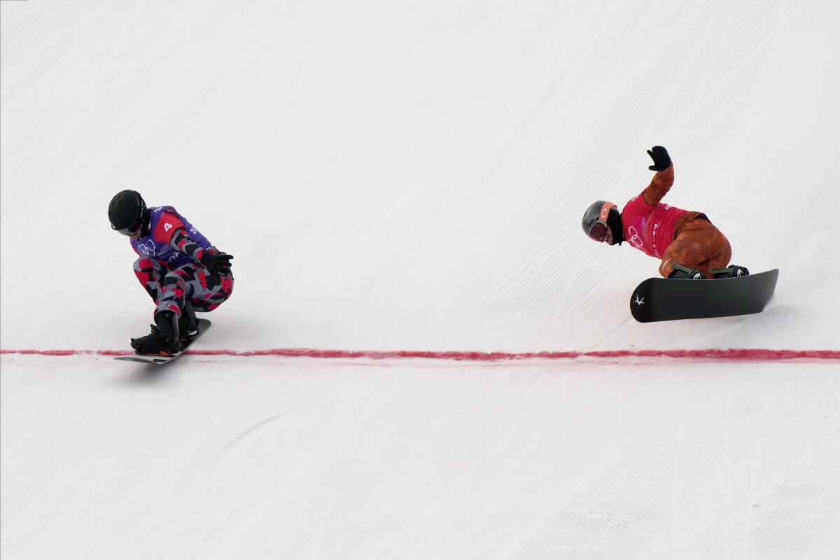 Austria's Alessandro Haemmerle crosses the finish line ahead of Canada's Éliot Grondin to win a gold medal