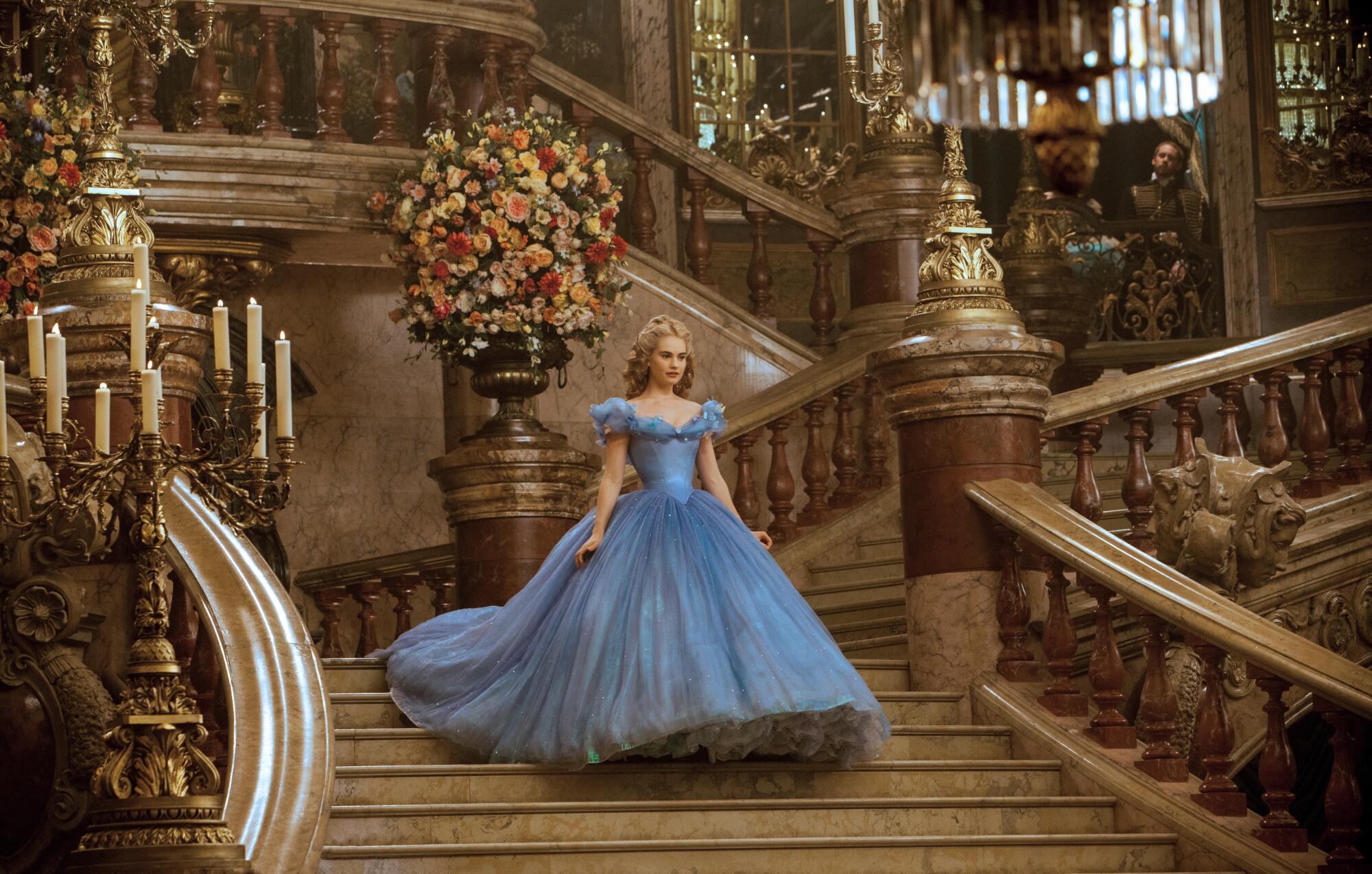James seen as Cinderella in Disney's live-action feature inspired by the classic fairy tale of the 1950 animated masterpiece.