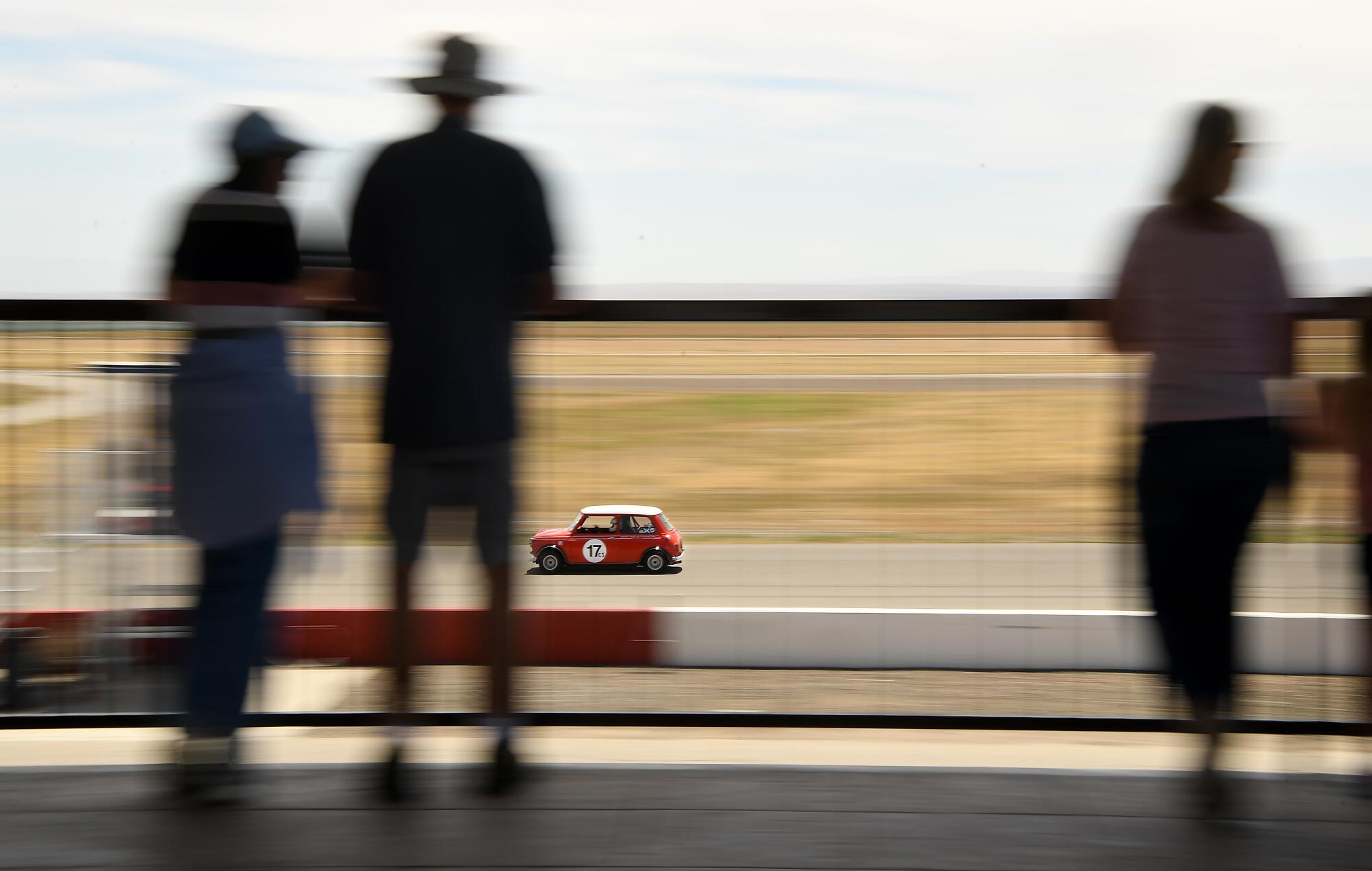 A race car makes its way around the track at Buttonwillow Raceway in Buttonwillow, Calif., on Saturday.