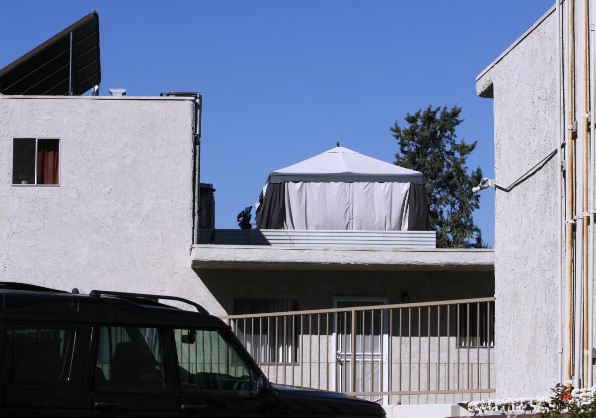 A large tent, or cabana, sits on top of the roof of an apartment building on the 500 block of East Cypress Street in Glendale on Wednesday, Oct. 16, 2013.